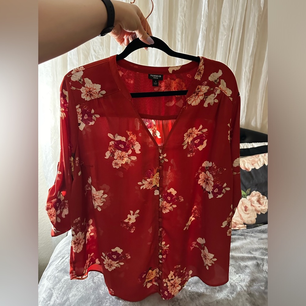 Orangey reddish floral blouse with button detail